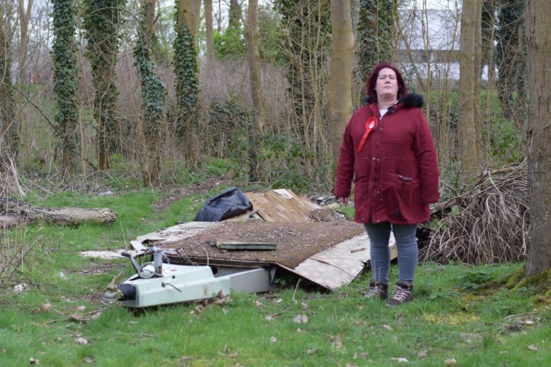Local activist and Labour candidate Anne Cryer-Whitehead highlighting the blight of fly-tipping on her estate, Fullers Slade
